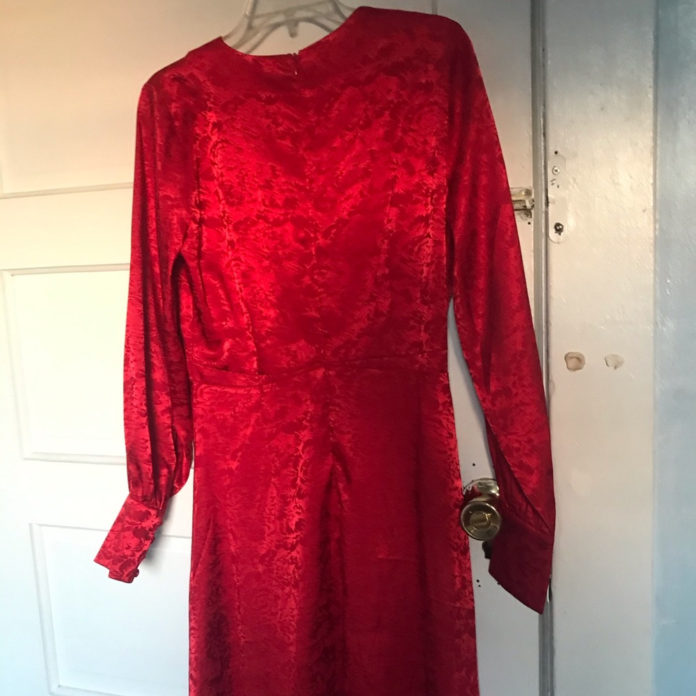 Red dress with a tiny rip in the middle NEVER WORN